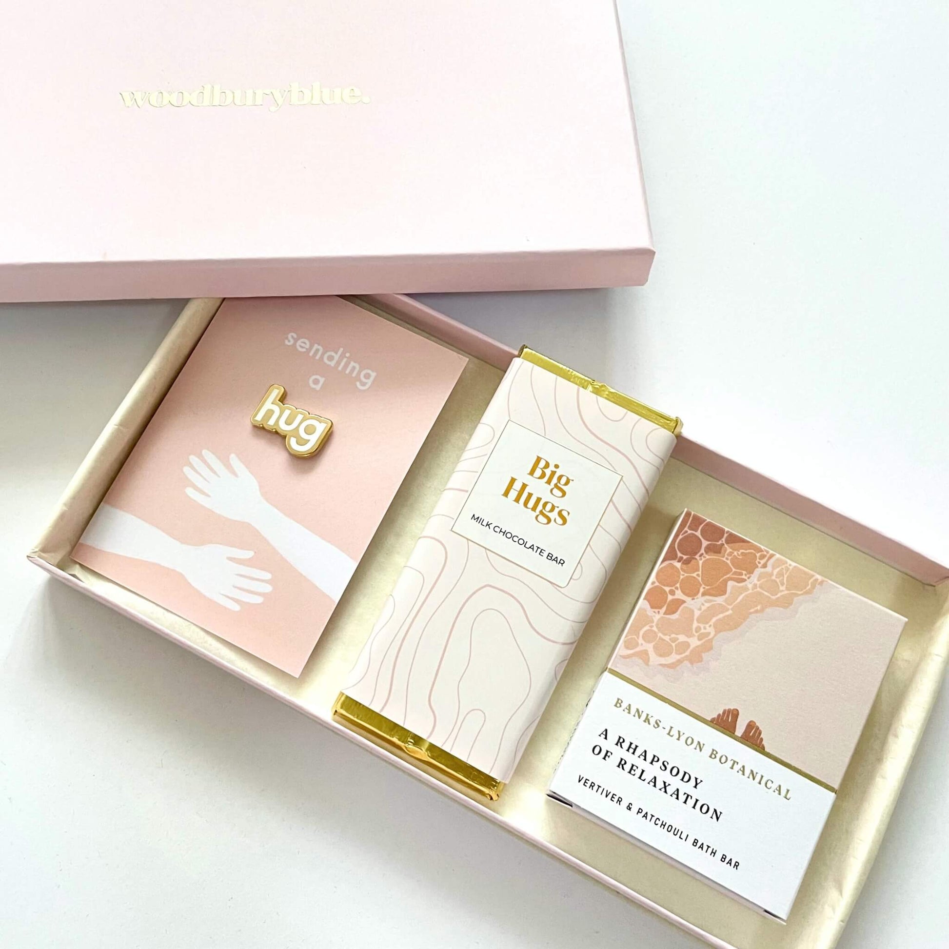 Thoughtful letterbox gift for friends – includes enamel pin and personalized note.