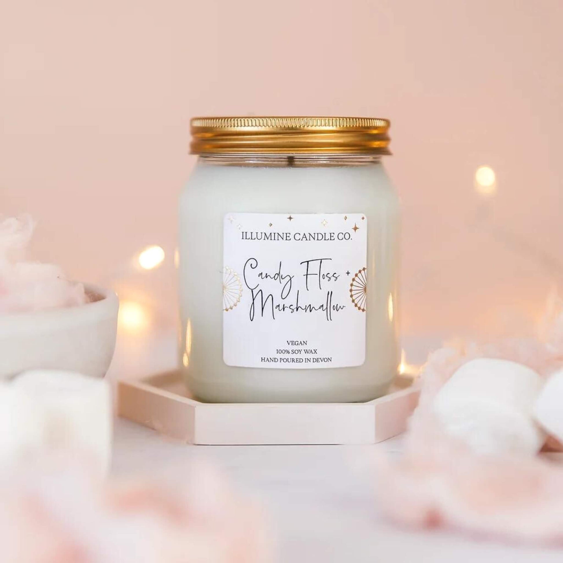 Candy floss and marshmallow scented soy wax candle in a glass jar