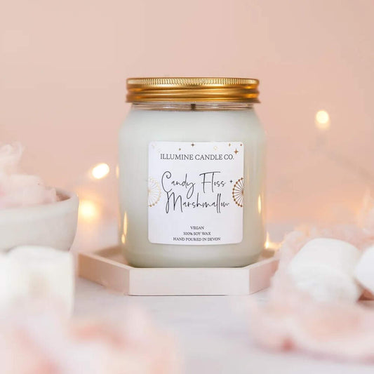 Candy floss and marshmallow scented soy wax candle in a glass jar
