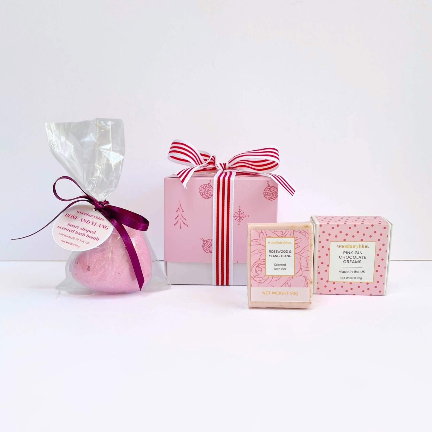 Heart shaped bath bomb with soap and chocolate and a christmas gift box