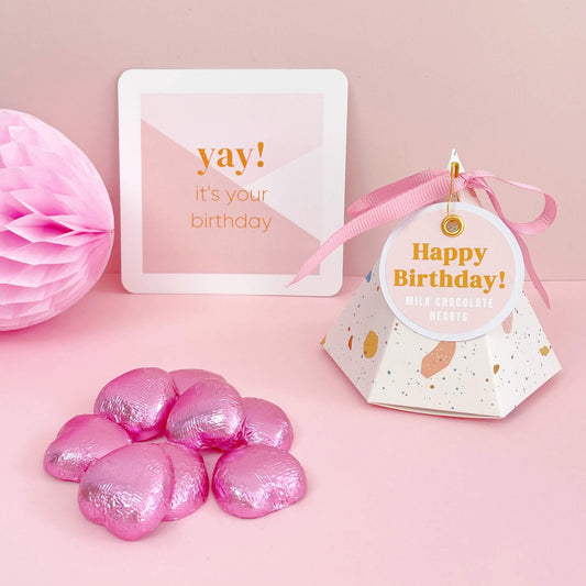 Happy birthday chocolate filled pyramid gift box with pink foil chocolate hearts