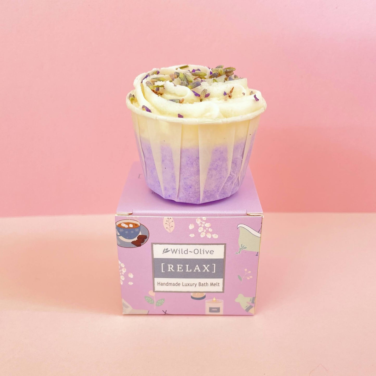 Lavender bath melt resting on Wild Olive purple box – handmade cocoa butter treat with calming essential oils