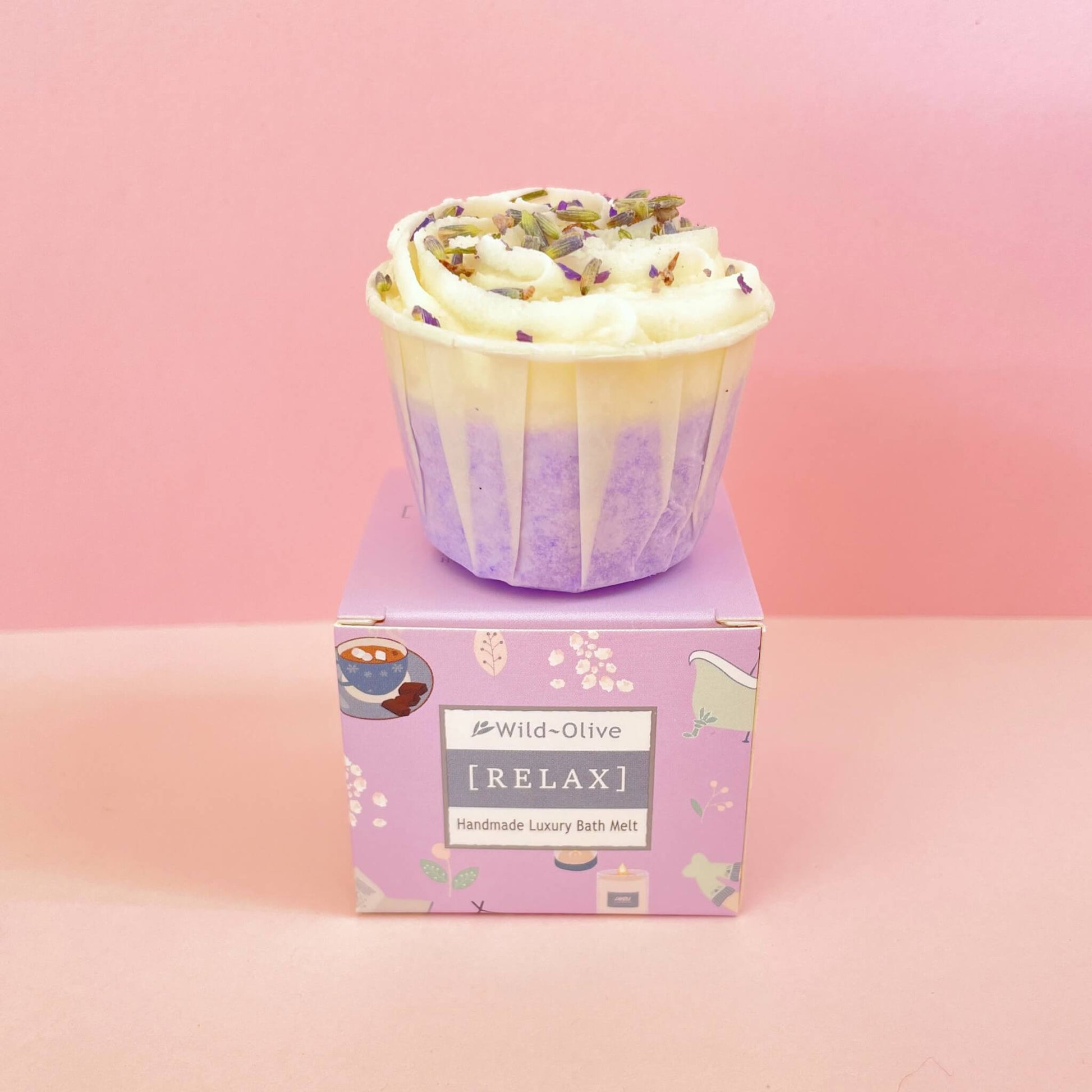 Lavender bath melt resting on Wild Olive purple box – handmade cocoa butter treat with calming essential oils