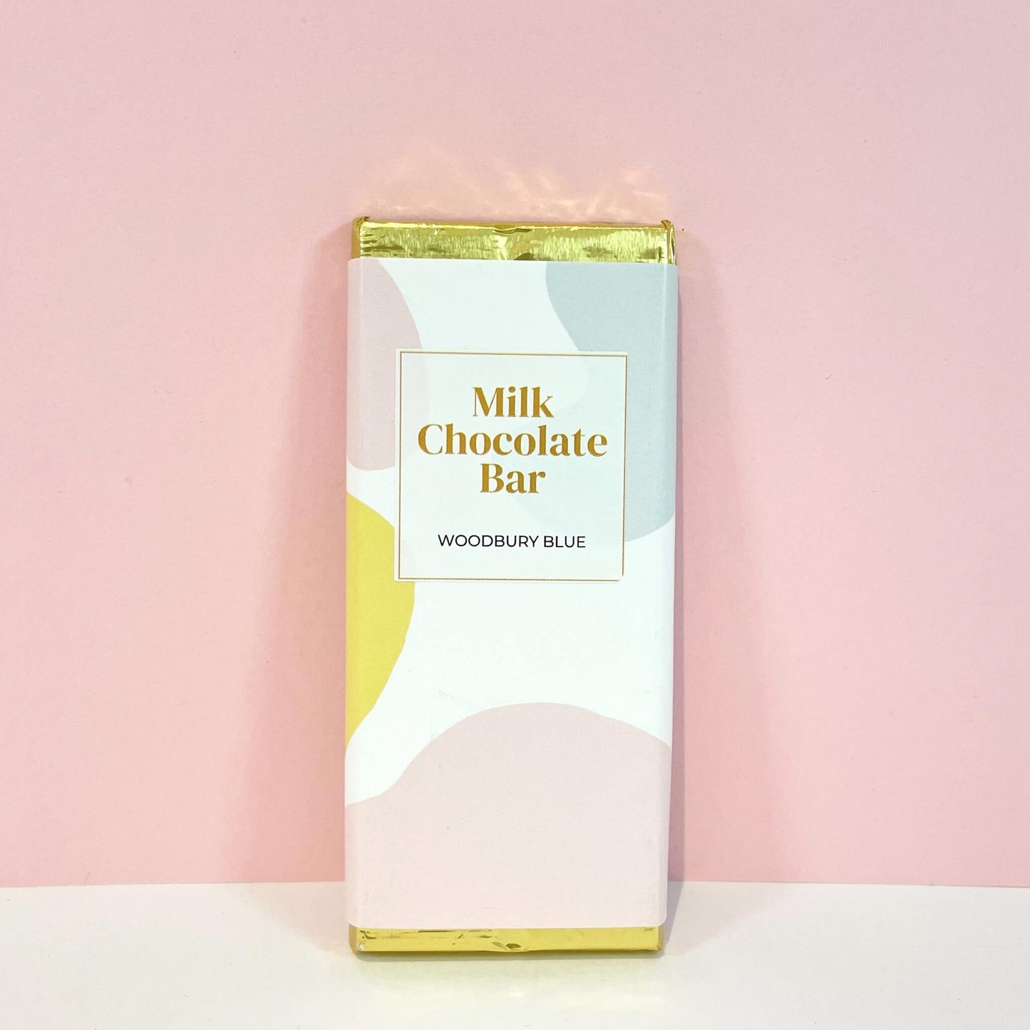 Woodbury Blue branded milk chocolate bar with abstract pastel design – a versatile chocolate gift for any occasion.