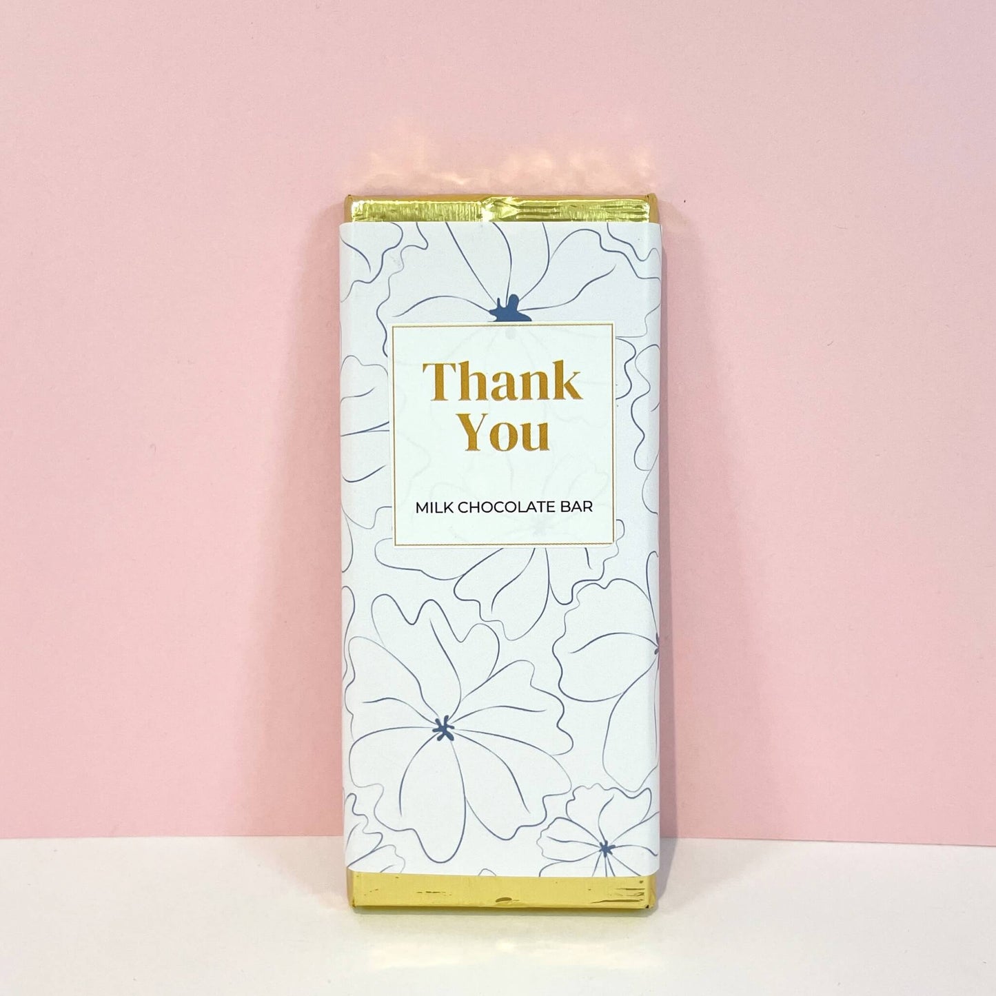 Milk chocolate bar wrapped in floral-themed packaging with a "Thank You" message – a thoughtful treat to show appreciation.