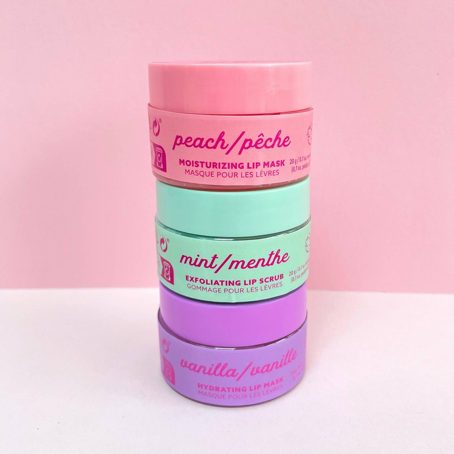 Three pots of lip treatments stacked on top of each other