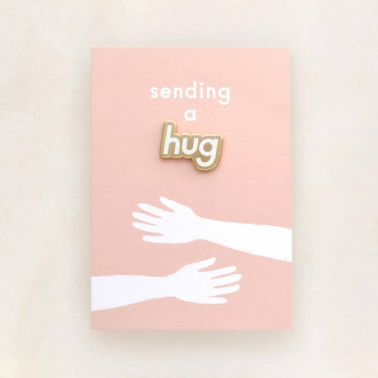 Sending a hug enamel pin badge on backing card
