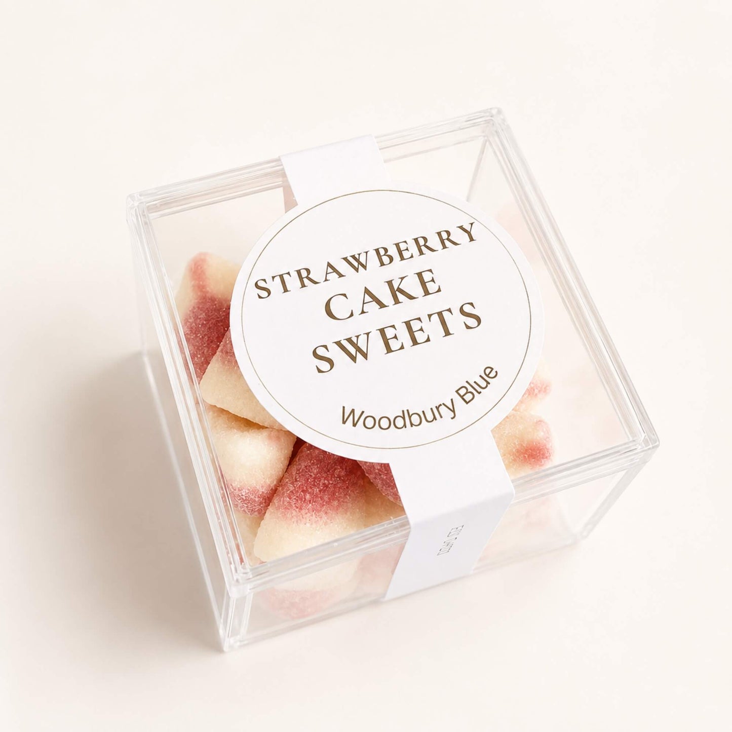 Pink and white strawberry and vanilla jelly sweets in Woodbury Blue packaging