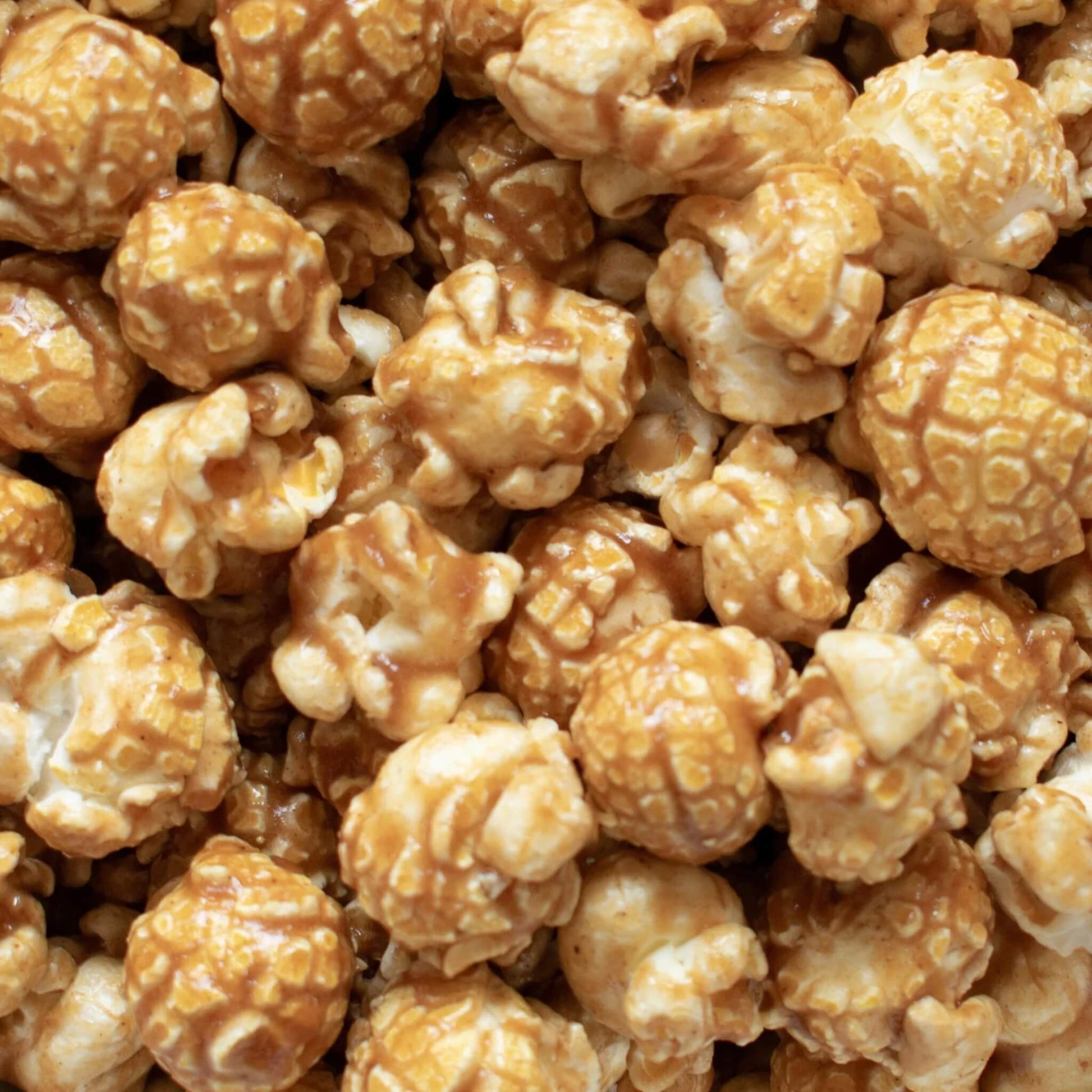 Close-up of Vegan Gingerbread Gourmet Popcorn showing caramel coating and spiced glaze.