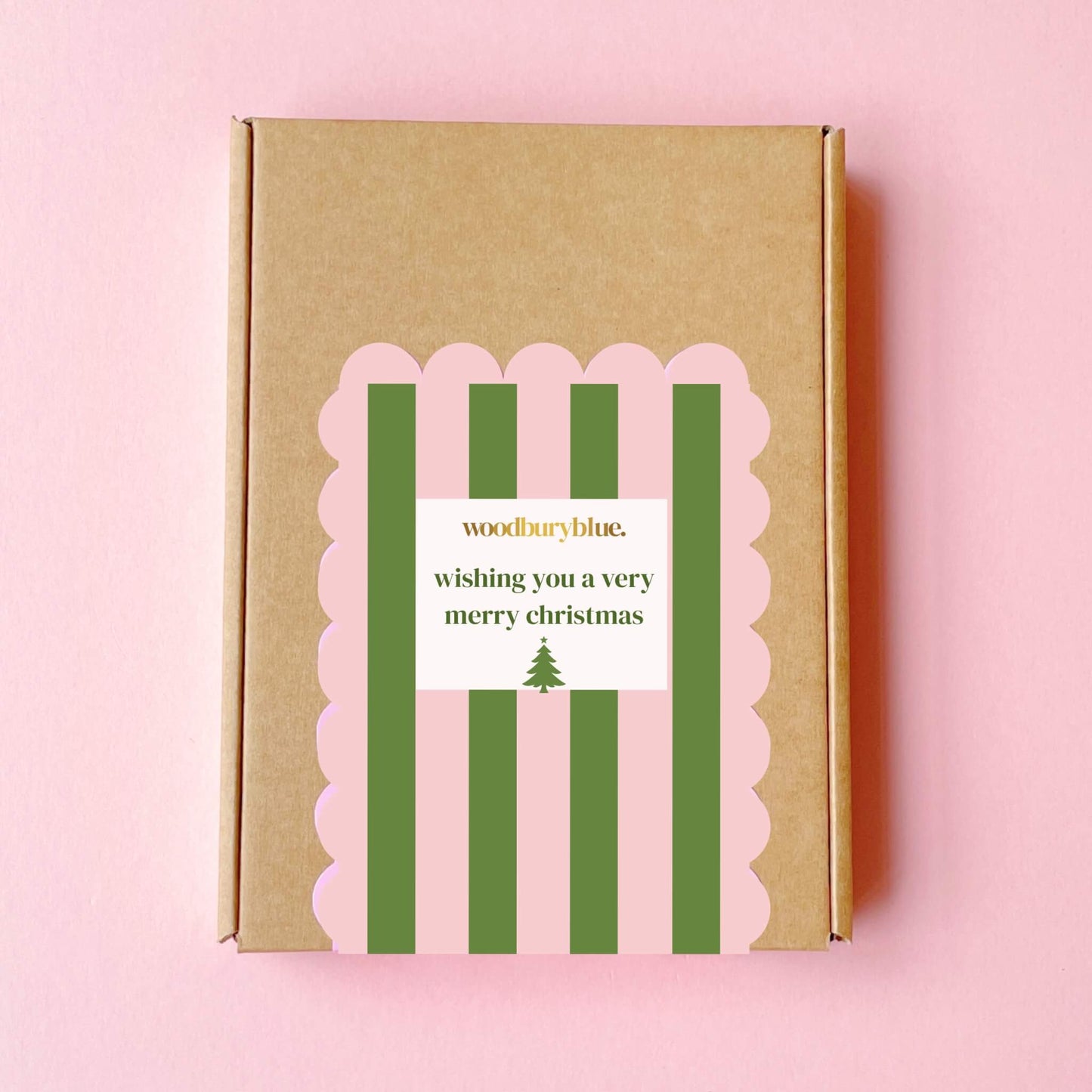 Christmas letterbox gift box with pink and green stripes and wishing you a very merry christmas label by Woodbury Blue