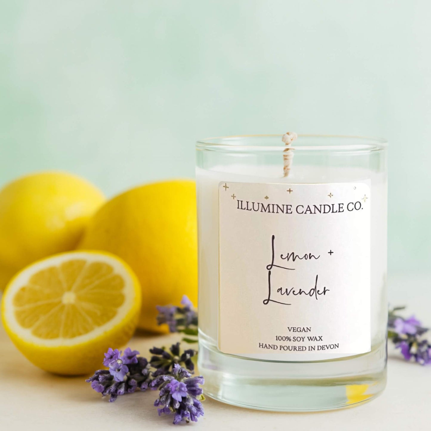 Lemon and Lavender Candle by Illumine Candle Co with lemons and lavender on a modern fresh background