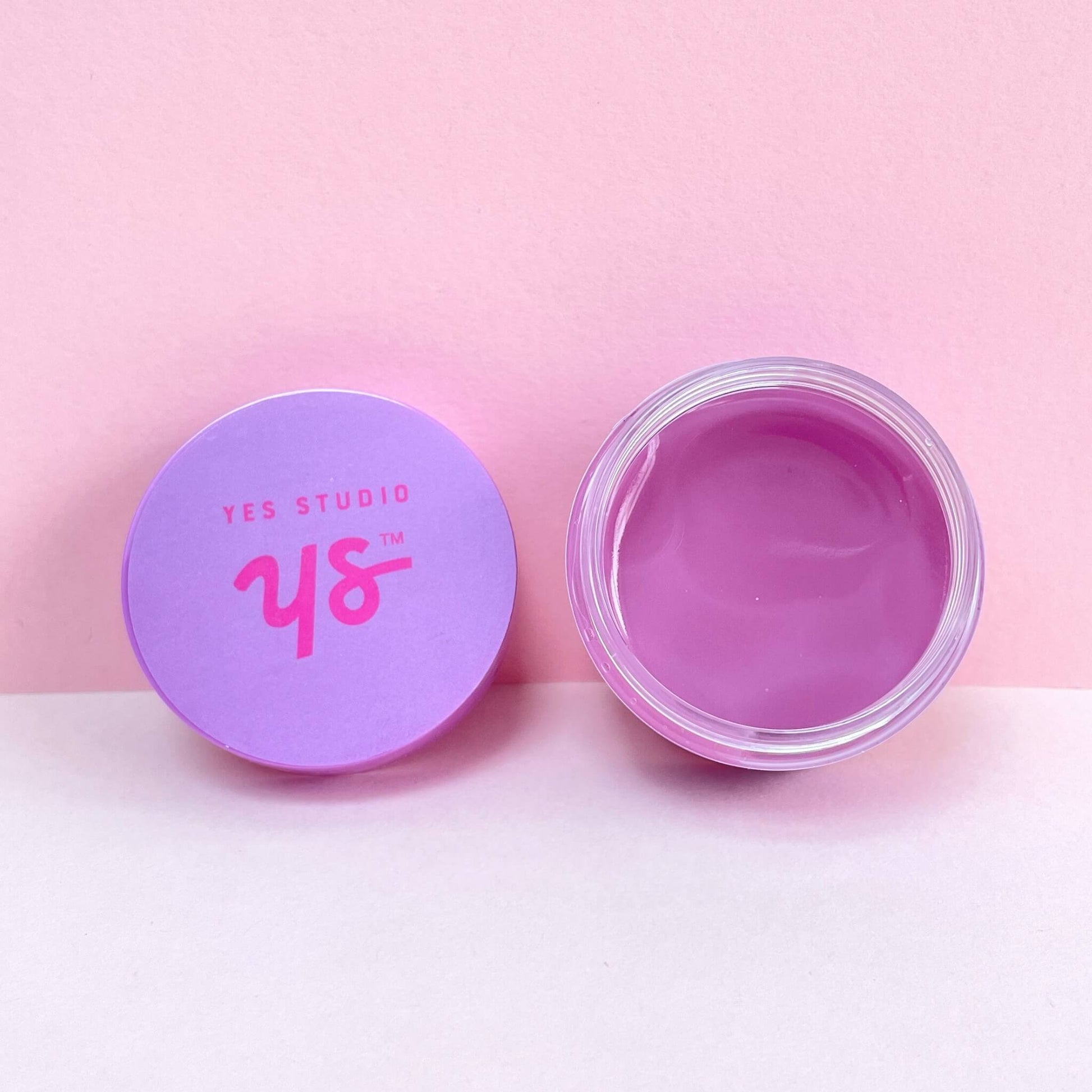 Open pot of vanilla lip mask with lid