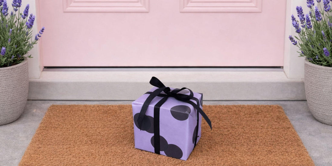 Thoughtful birthday gift box left on a doorstep with lavender plants, ideal for forgotten birthday gifts that still feel considered