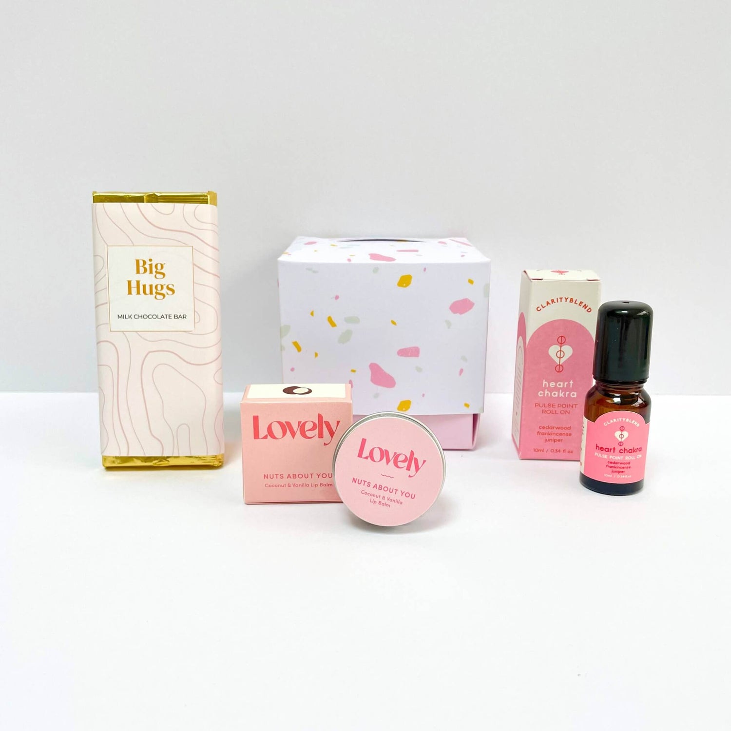 Colourful pre-filled gift cubes with birthday and self-care themed treats from Woodbury Blue – including chocolate, candles, and aromatherapy.