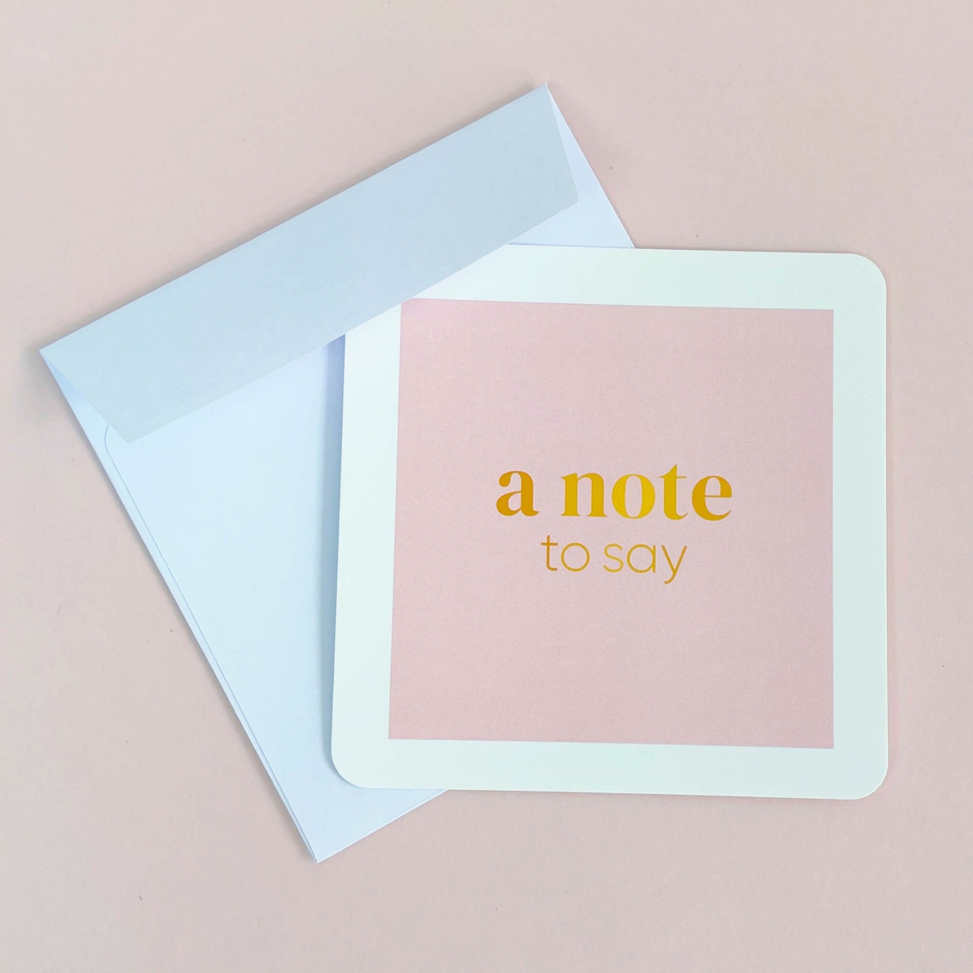 Flatlay of pastel 'a note to say' notecard – perfect for personalised romantic gifts