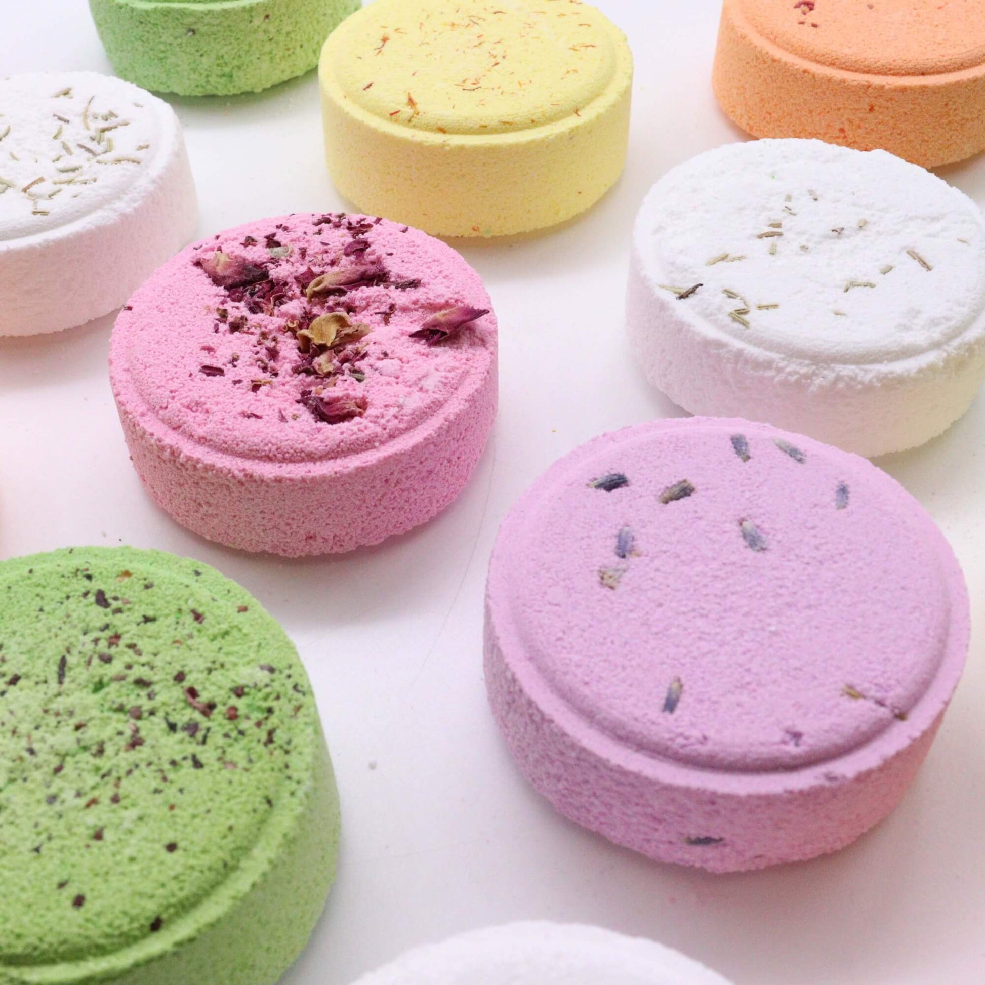 Variety of aromatherapy shower steamers on a white background 