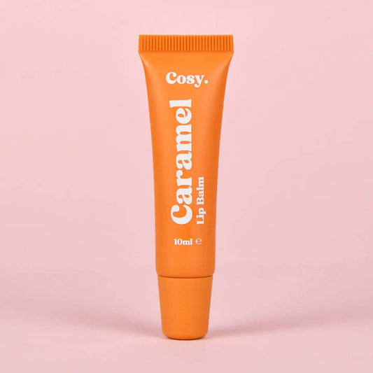 Cosy Cosmetics Caramel Lip Balm 10ml in an orange tube with a nourishing vegan formula for soft, moisturised lips.
