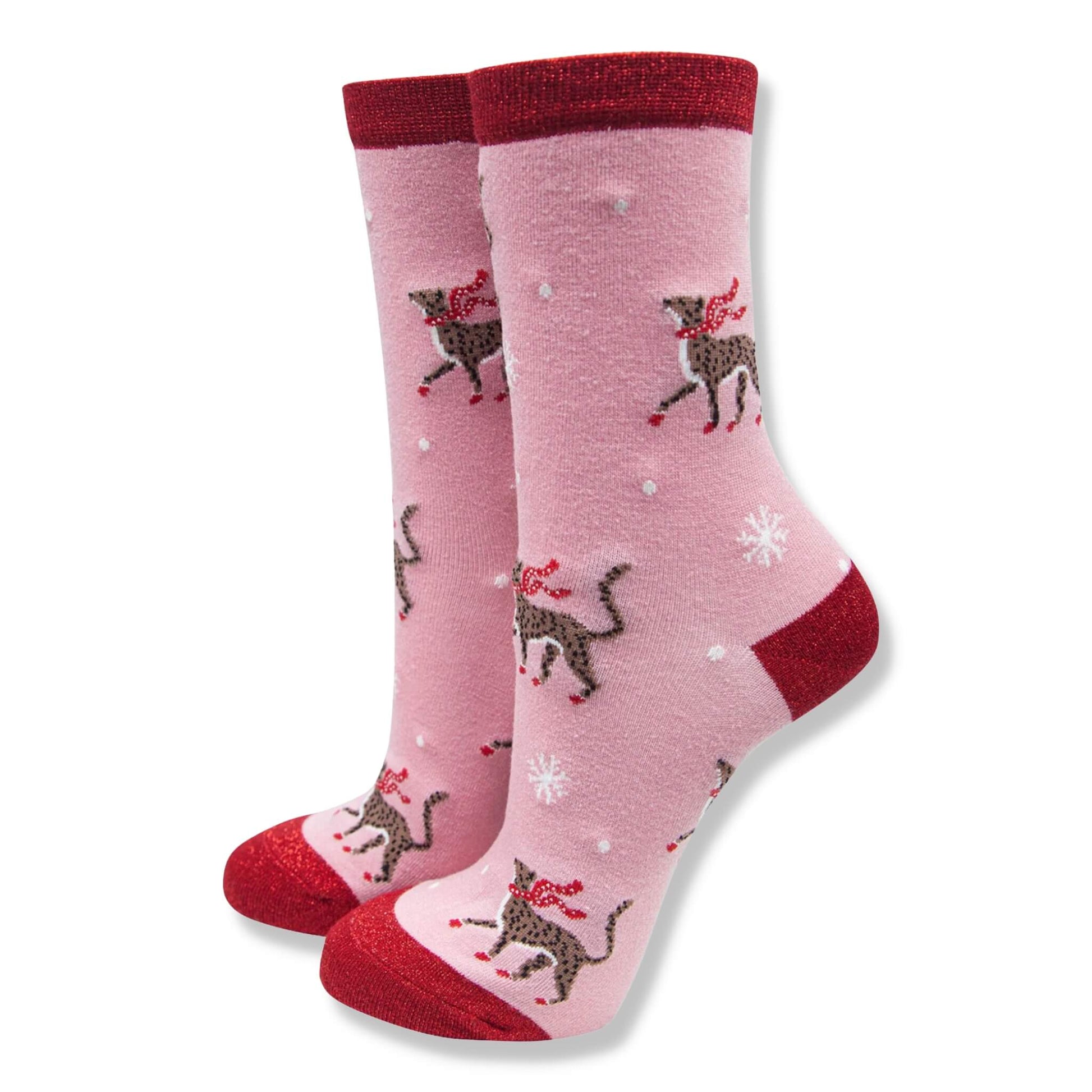 Pink and red Christmas socks with a fun cheetah and snowflake pattern