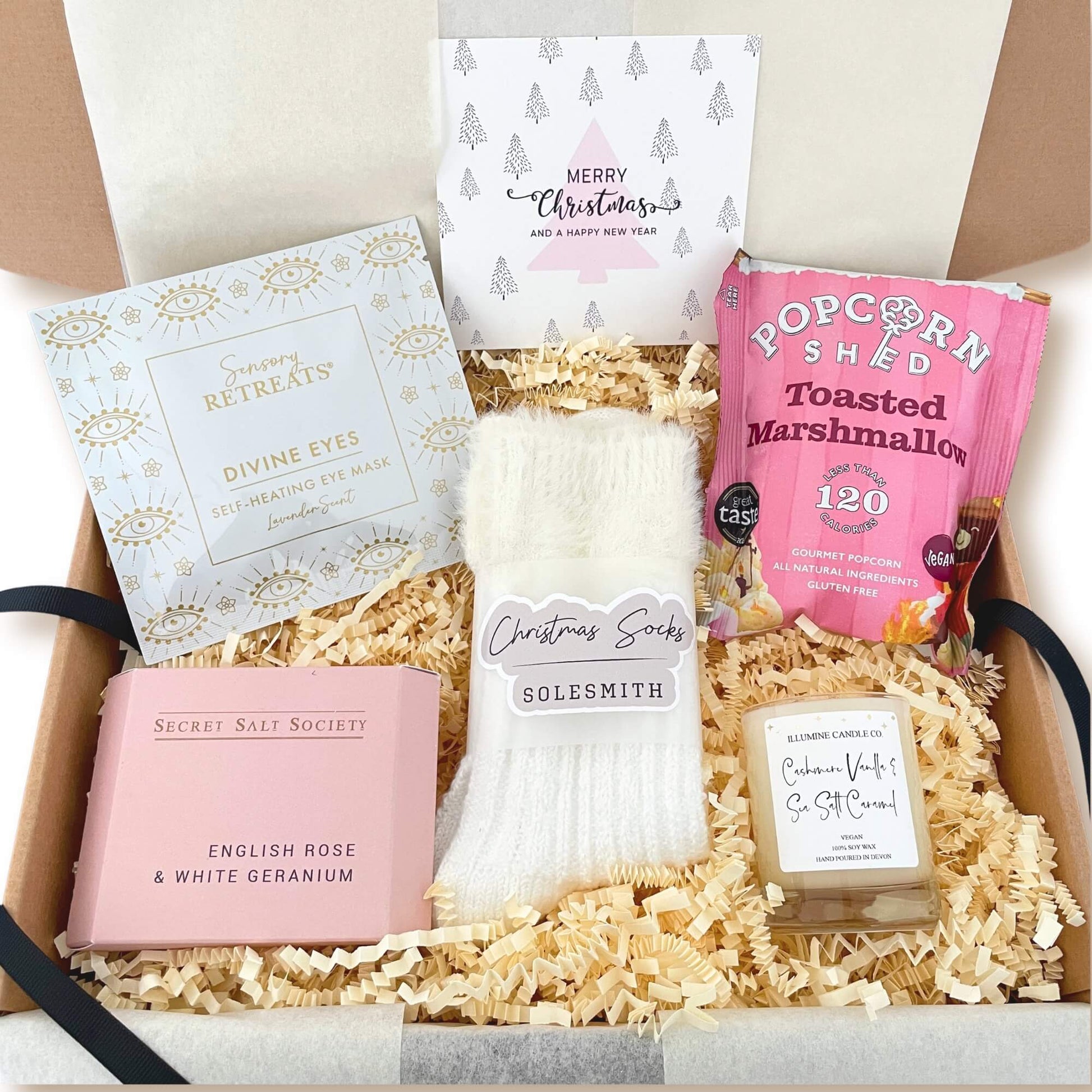 Cosy Christmas Gift Box filled with fluffy Solesmith socks, toasted marshmallow popcorn, a candle, bath soak and a self heating eye mask.