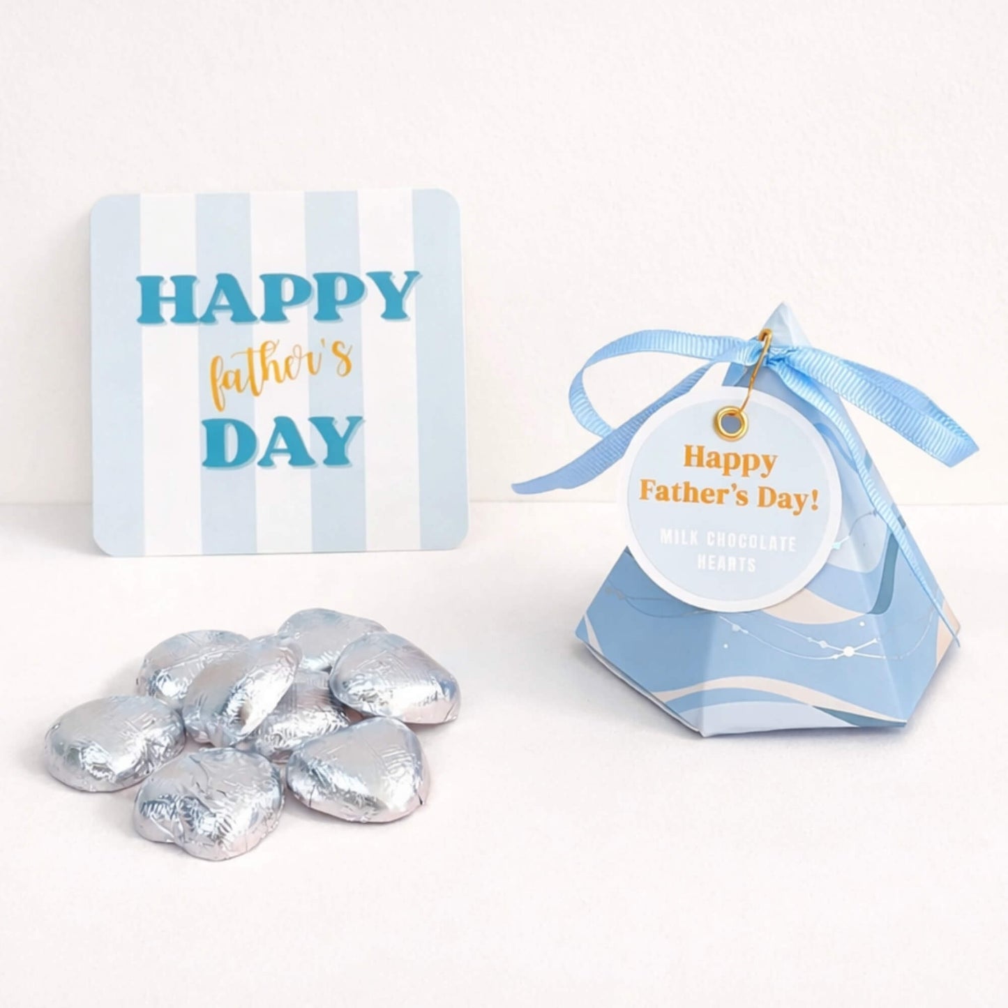 Father’s Day chocolate box with silver foiled milk chocolate hearts, blue ribbon, gift tag and Father’s Day notecard