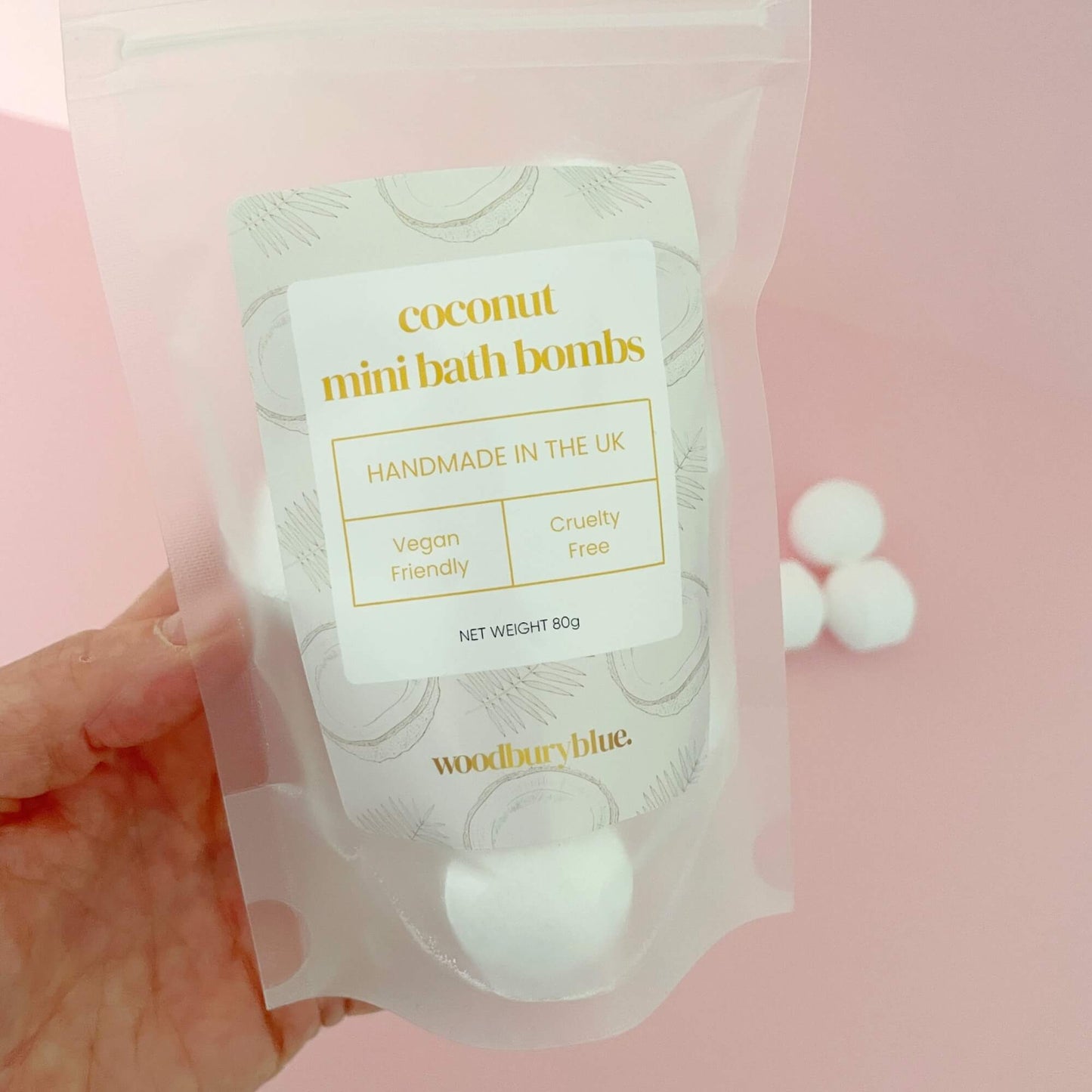 Hand holding a pack of mini coconut bath bombs – ideal for tropical-themed pamper gifts
