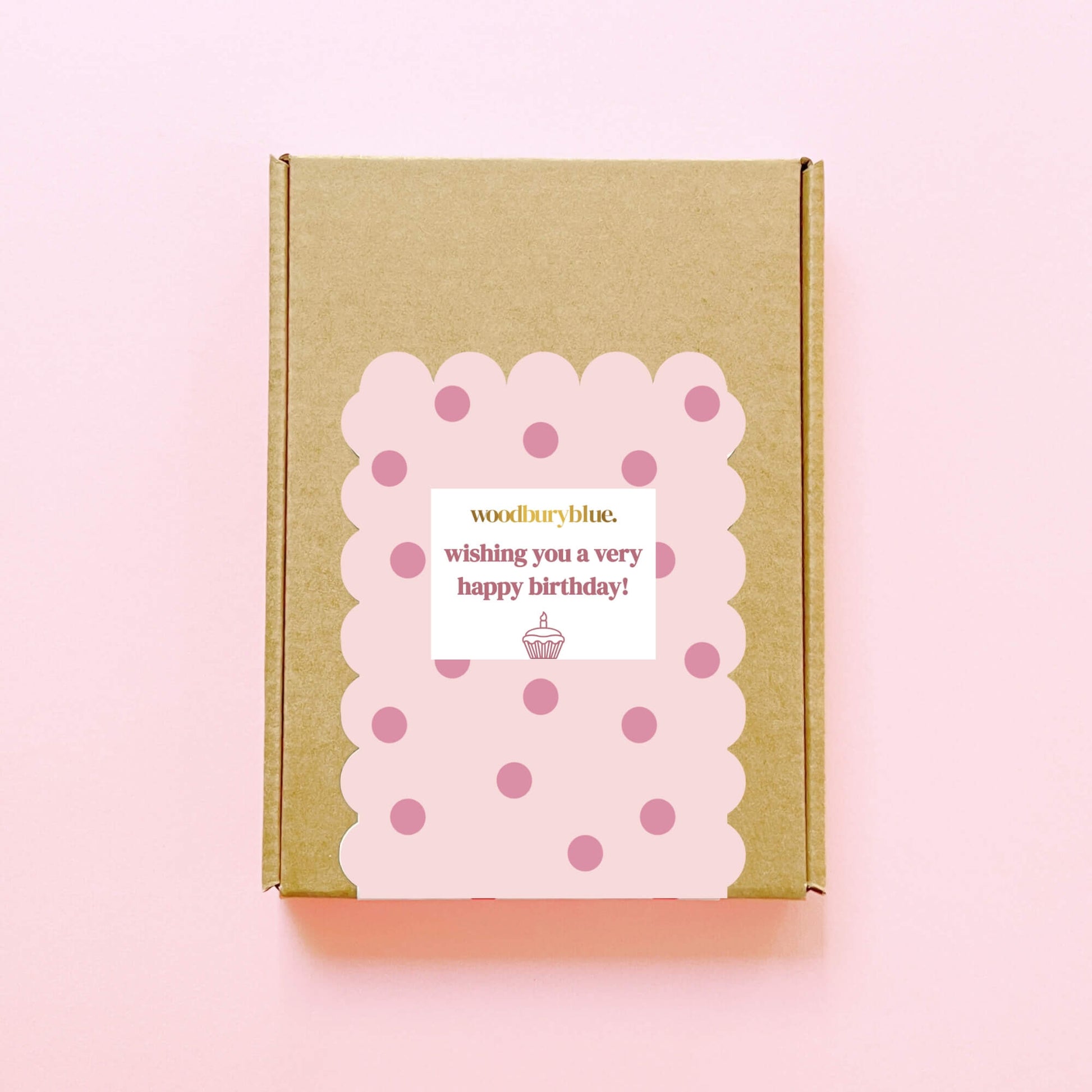 Closed Happy Birthday letterbox gift box with pink polka dot label and cupcake design by Woodbury Blue.