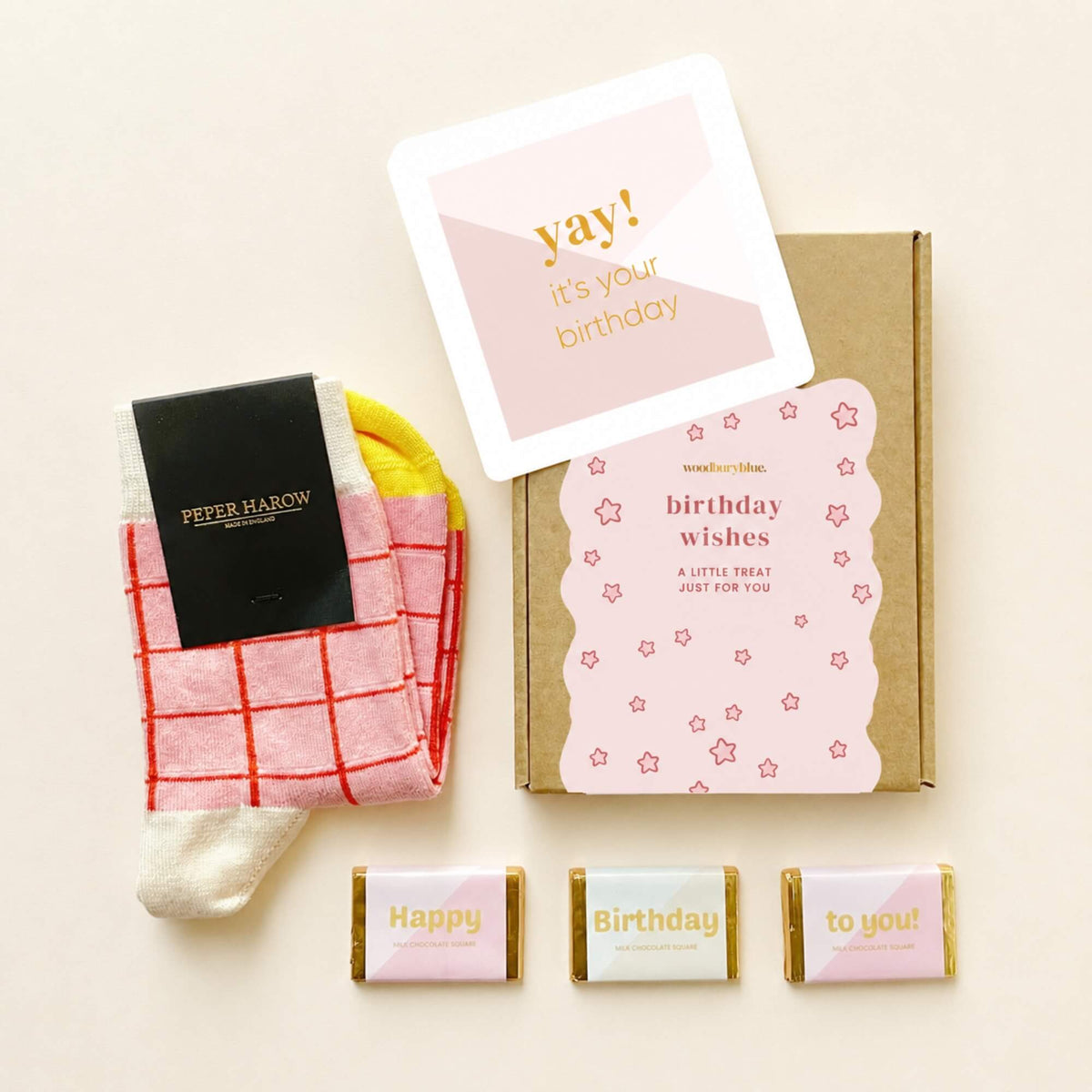 Happy Birthday Socks and Chocolate Letterbox Gift with pink checked Peper Harow socks, three milk chocolates, birthday notecard and kraft gift box.