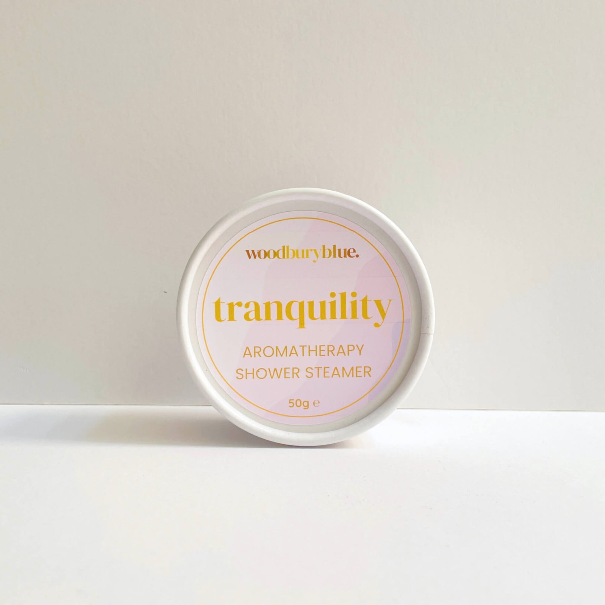 Woodbury Blue Tranquility aromatherapy shower steamer in its branded round box