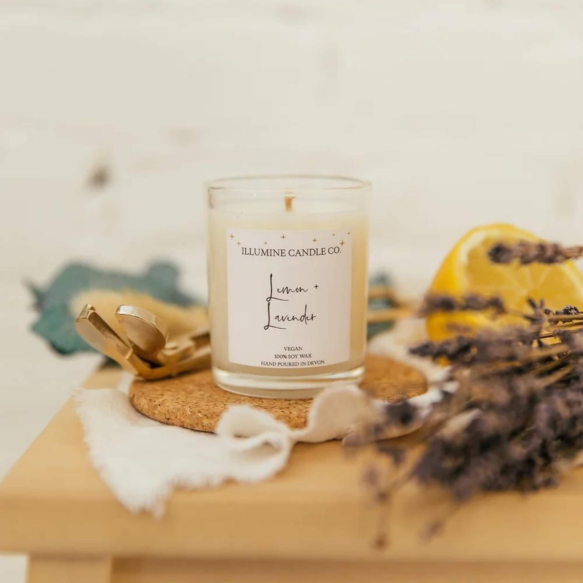 Soy wax candle in a glass jar with a lemon and lavender scent