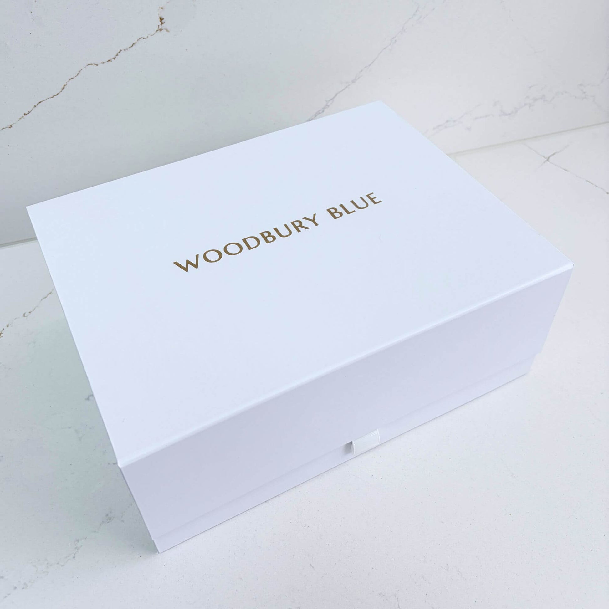 White Woodbury Blue presentation box for a luxury birthday pamper gift box.