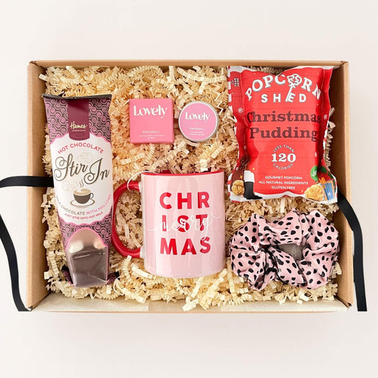 Merry Christmas Gift Box with hot chocolate stir in, Christmas mug, popcorn, lip balm and pink scrunchie.