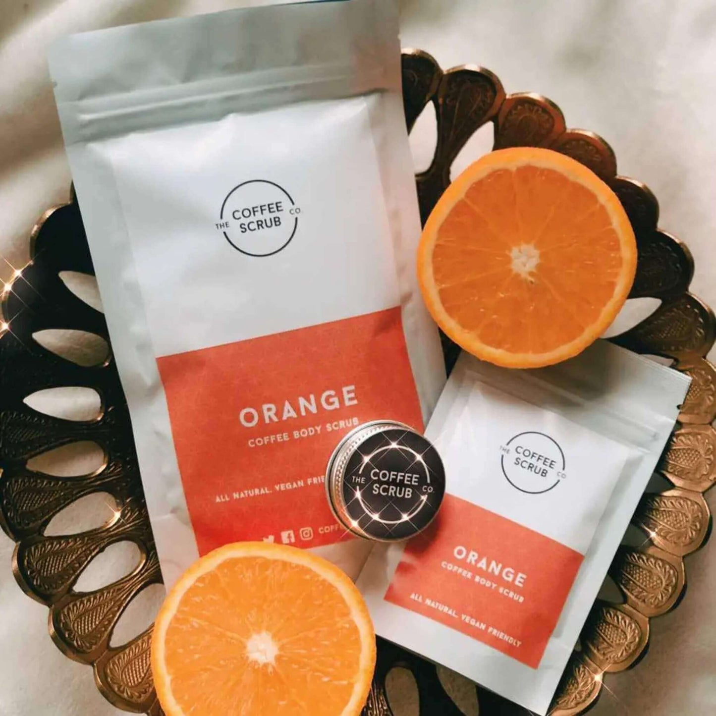 Lifestyle picture of orange coffee body scrub