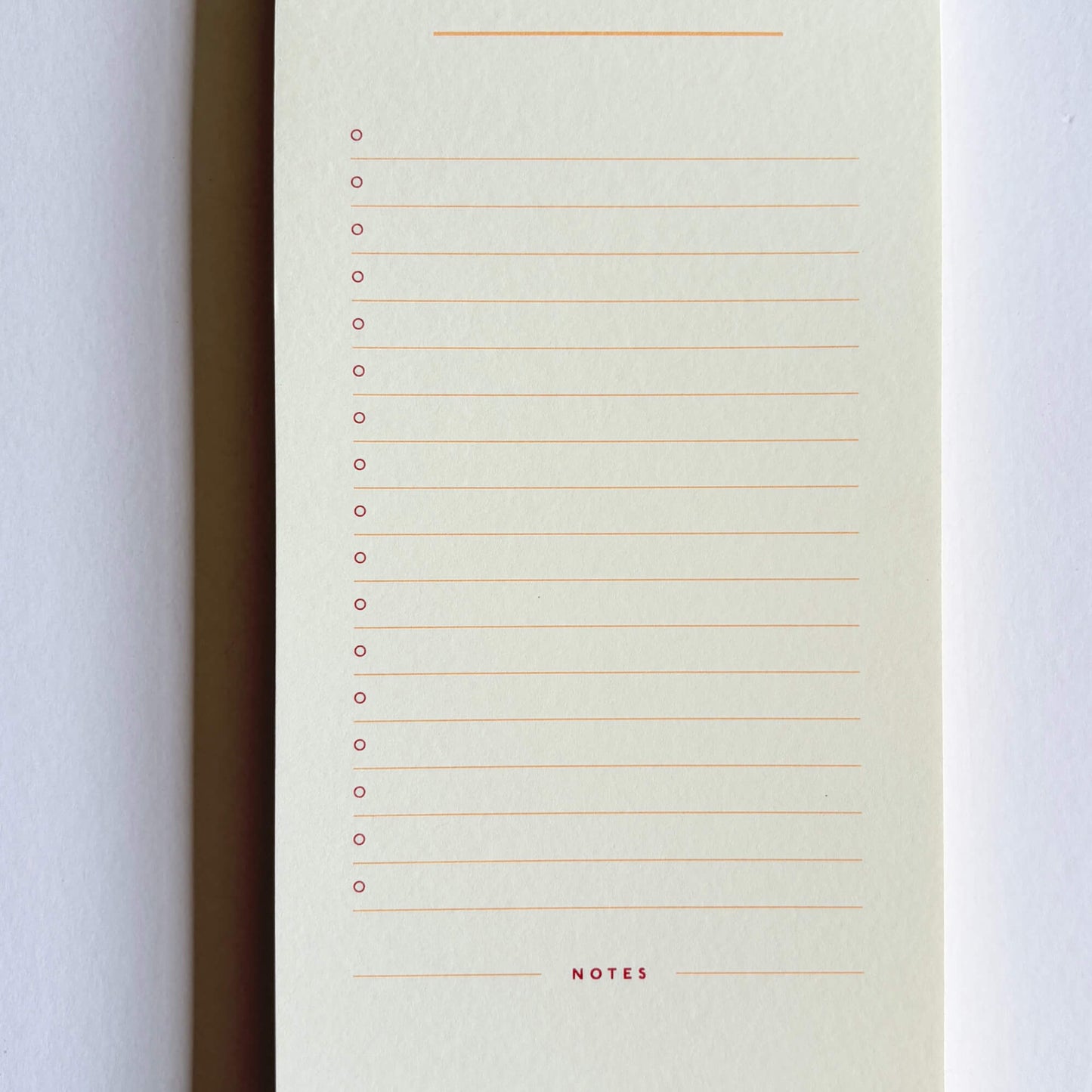 Inside page of a Papier list notepad with lined tasks, check circles and a notes section at the bottom.
