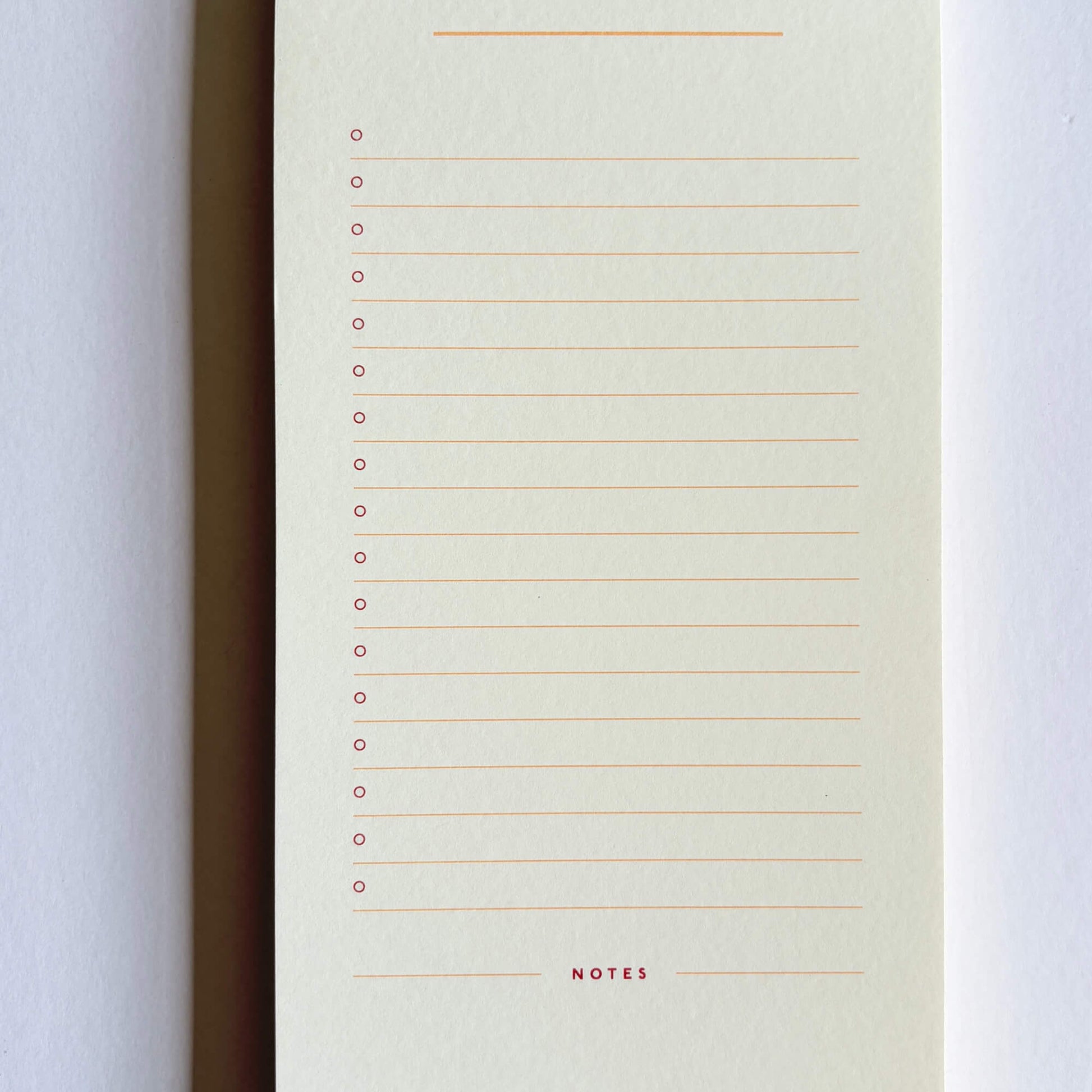 Inside page of a Papier list notepad with lined tasks, check circles and a notes section at the bottom.