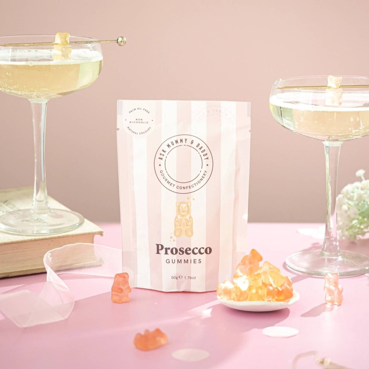Prosecco gummy sweets by Ask Mummy & Daddy styled with sparkling drinks and gummy bears