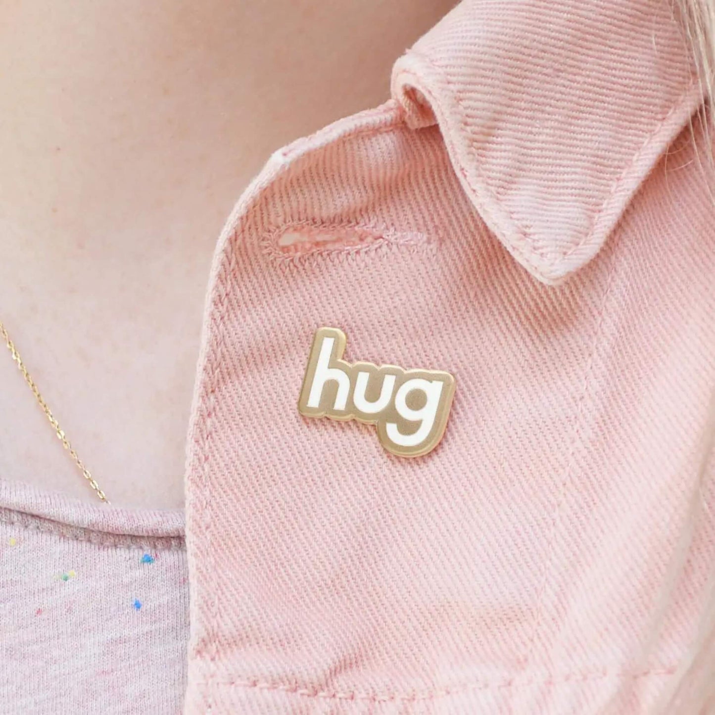 Hug enamel pin badge on outfit