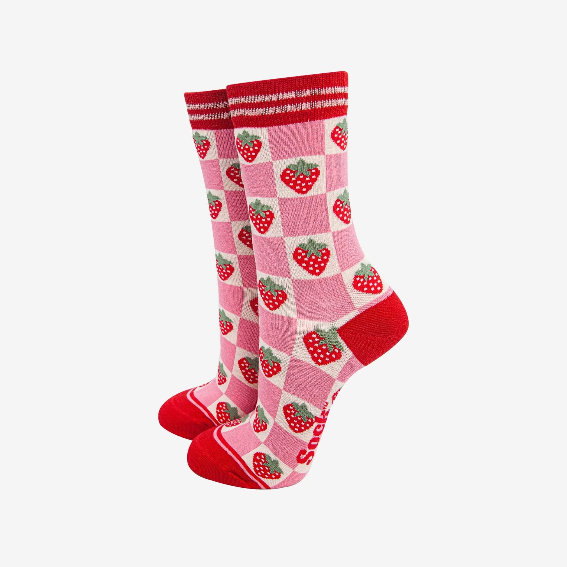 Pair of Sock Talk strawberry patterned socks in pink and red displayed against a white background.