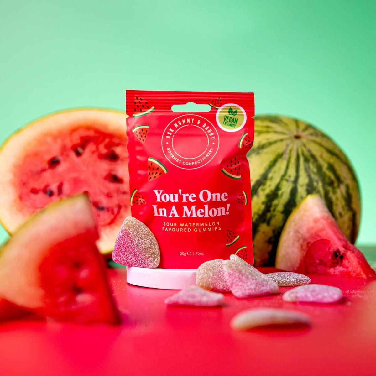 You’re One in a Melon vegan sour watermelon gummies styled with fresh watermelon