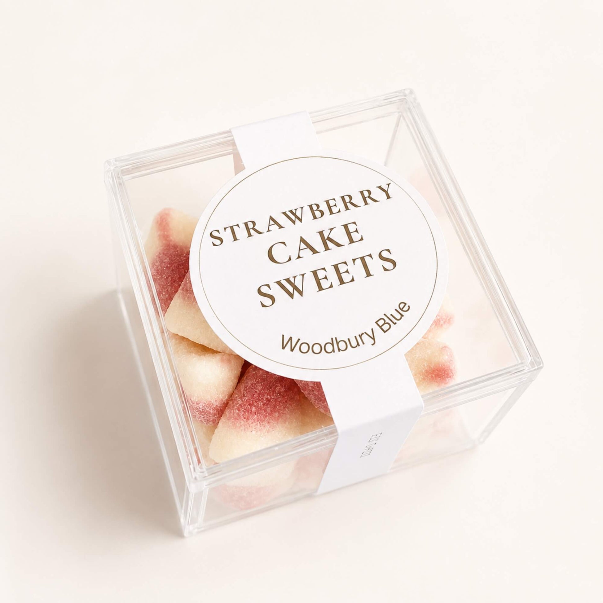 Pink and white strawberry and vanilla jelly sweets in Woodbury Blue packaging