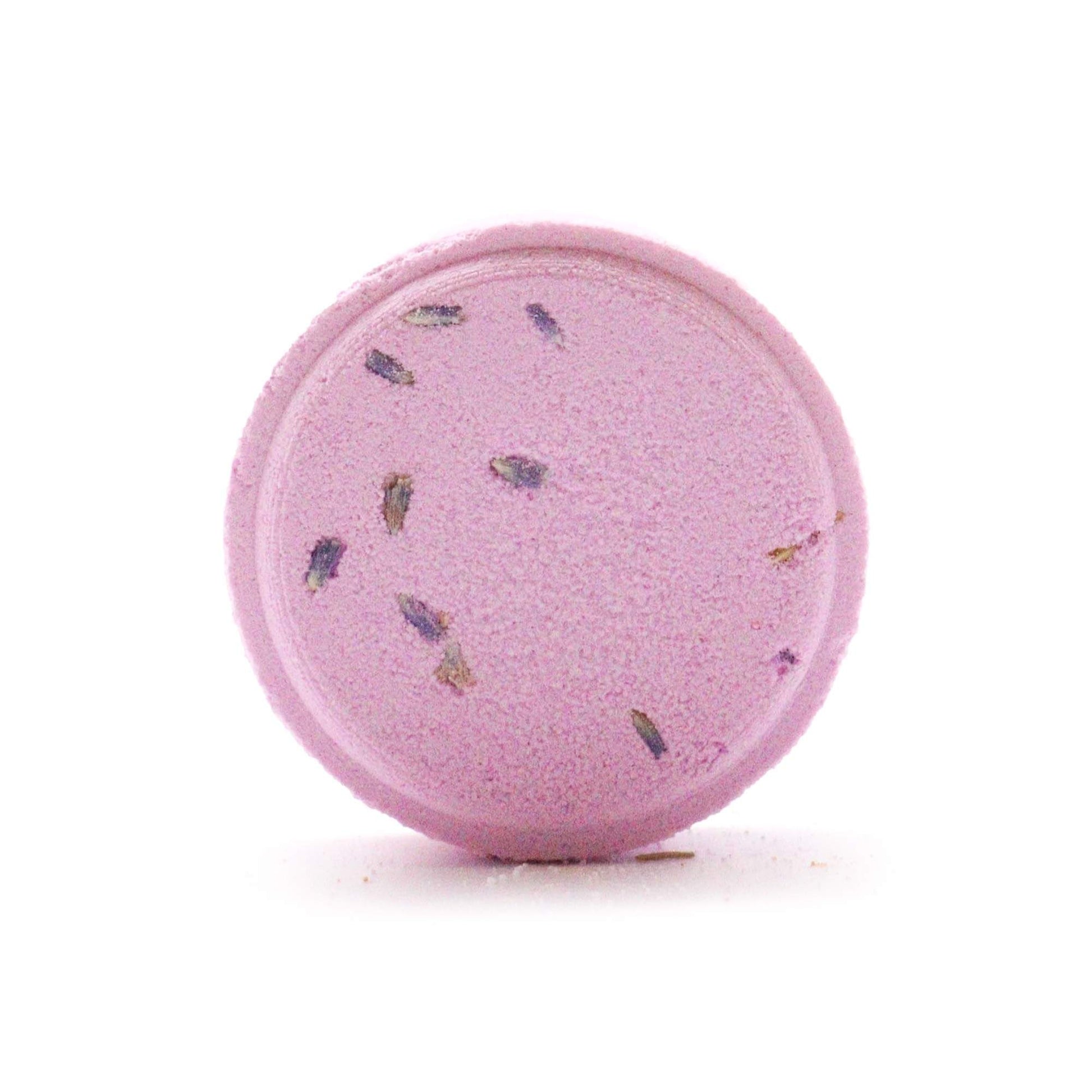 Unwrapped lavender-infused aromatherapy shower steamer with visible flower buds
