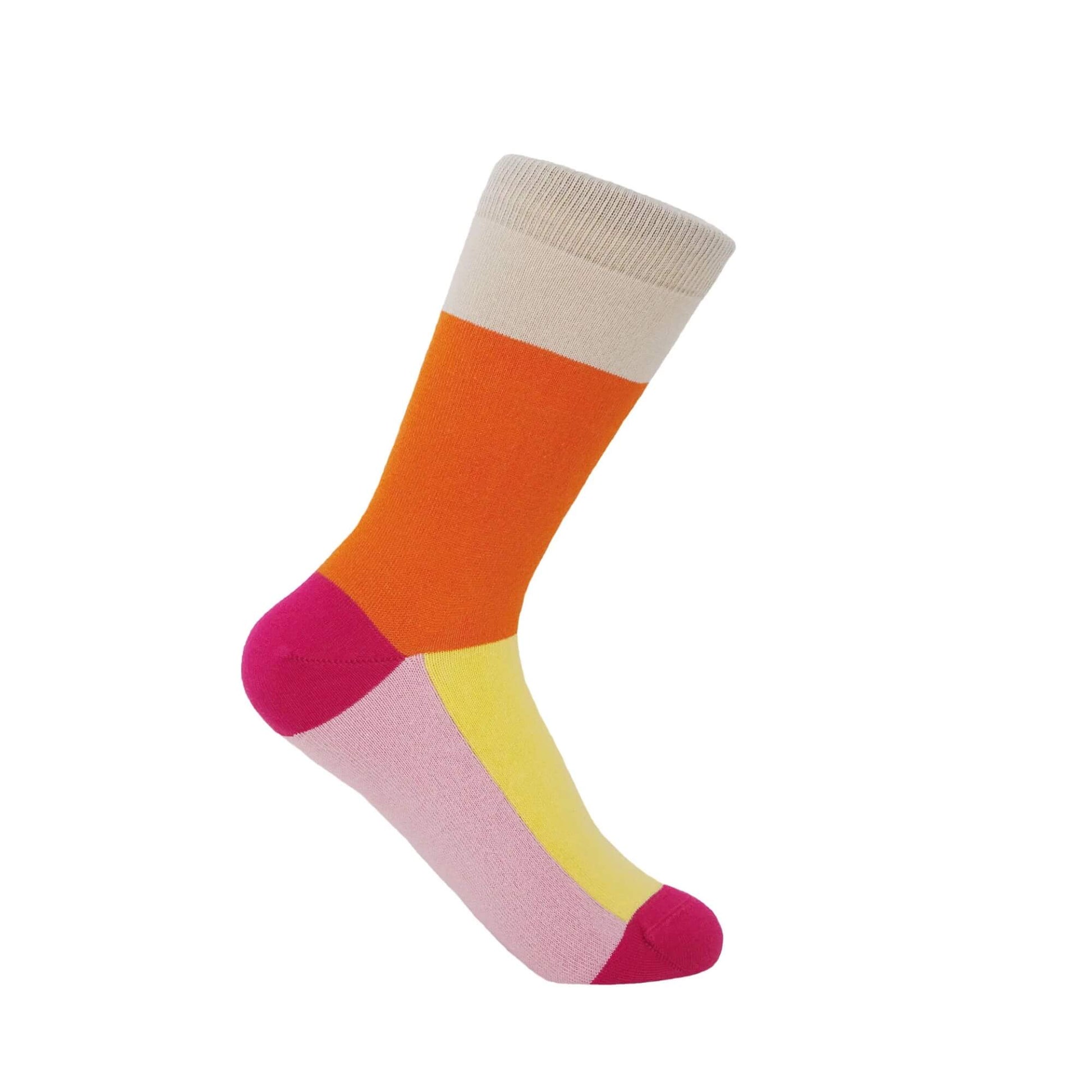 Luxury Peper Harow cotton sock in bright orange, pink, yellow and cream colour block design photographed on a white background.