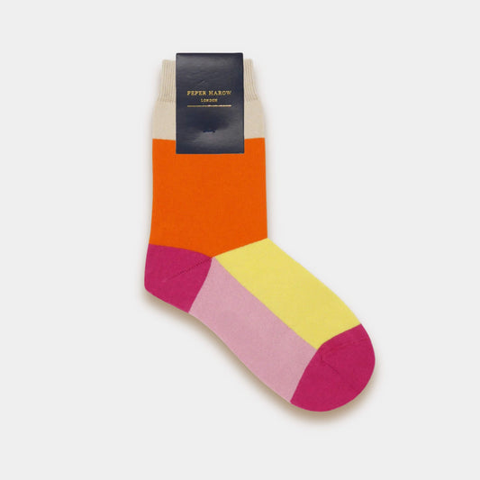 Peper Harow luxury cotton socks in orange, pink and yellow colour block design shown with the branded black label on a white background.