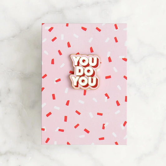 You Do You enamel pin badge with gold edge on pink card with red and white sprinkles